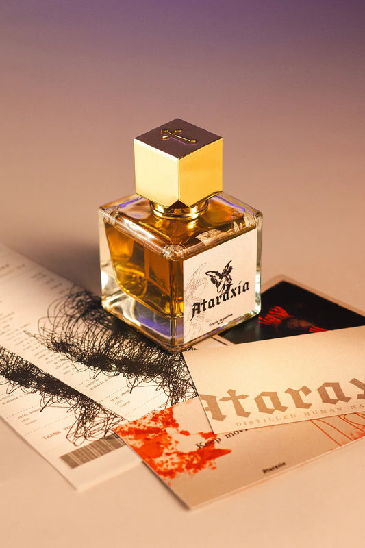 A bottle of Ataraxia's Amaretto Jazz in the Melting Room perfume with its cards